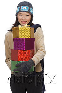 AsiaPix - Young woman with gift boxes, smiling at camera
