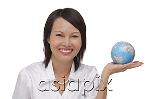 AsiaPix - Woman holding globe and smiling at camera