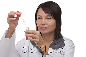 AsiaPix - Scientist holding pipette and flask