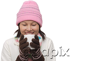 AsiaPix - Woman holding a cup and smiling