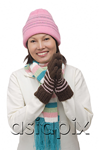 AsiaPix - Woman in winter clothing smiling at camera