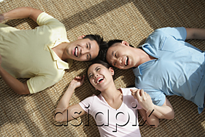 AsiaPix - Friends lying on the floor laughing