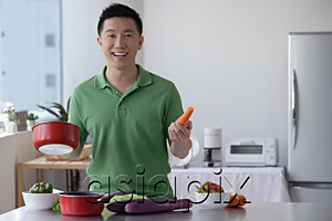 AsiaPix - Man cooking and smiling at camera