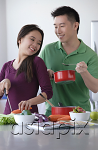 AsiaPix - Couple cooking together