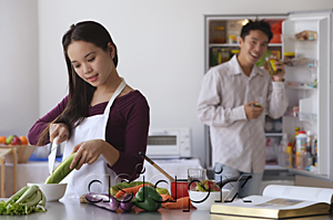 AsiaPix - Young couple cooking in the kitchen