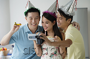 AsiaPix - Friends celebrating and videotaping it