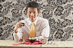 AsiaPix - Man having meal at restaurant