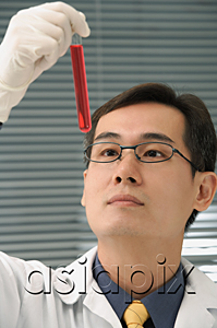 AsiaPix - Scientist examining test tube