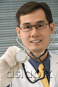 AsiaPix - Doctor with stethoscope smiling at camera