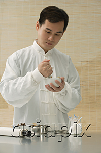 AsiaPix - Doctor experimenting with traditional Chinese medicine