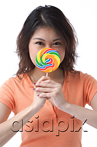 AsiaPix - Young woman with lollipop looking at camera