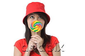 AsiaPix - Young woman with lollipop looking up