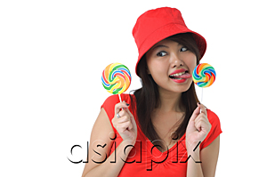 AsiaPix - Young woman licking on lollipop
