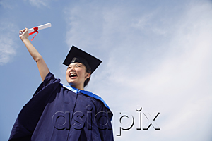 AsiaPix - University student in graduation robe cheering