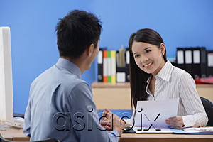 AsiaPix - Businessman and woman looking at each other