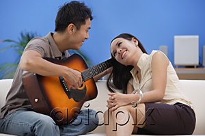 AsiaPix - Man serenading young woman