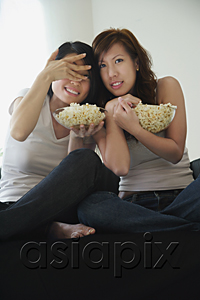 AsiaPix - Young women enjoying popcorn