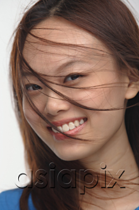 AsiaPix - Young woman smiling at camera