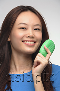 AsiaPix - Young woman with soap smiling at camera