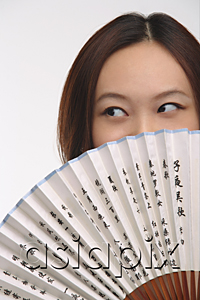 AsiaPix - Young woman with fan looking sideways