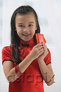 AsiaPix - Young girl in traditional Chinese dress and looking at camera