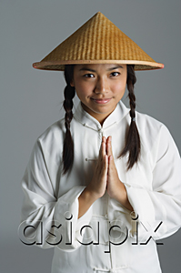 AsiaPix - Young woman in traditional Chinese dress looking at camera