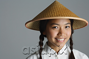 AsiaPix - Young woman in traditional Chinese dress smiling at camera
