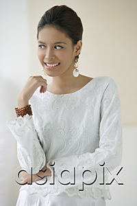 AsiaPix - Young woman smiling and glancing sideways
