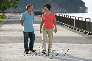 AsiaPix - Couple strolling along the waterfront