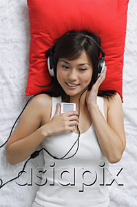 AsiaPix - Young woman listening to music