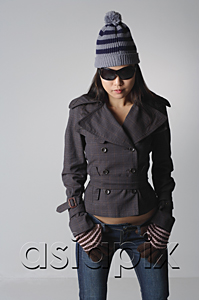 AsiaPix - Young woman with sunglasses and winter clothes