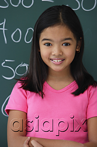 AsiaPix - Girl standing in front of blackboard