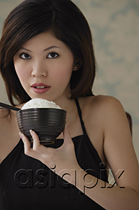 AsiaPix - Young woman with bowl of rice