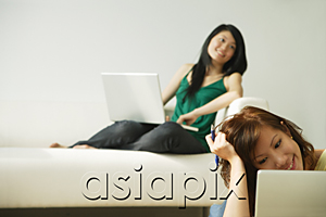 AsiaPix - Young women using laptops