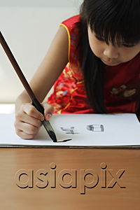 AsiaPix - Young girl practicing calligraphy