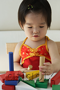 AsiaPix - Baby girl playing with building blocks