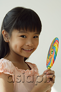 AsiaPix - Girl with big lollipop smiling at camera