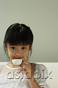 AsiaPix - Girl drinking from tiny cup