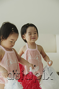 AsiaPix - Baby girls with pom-poms