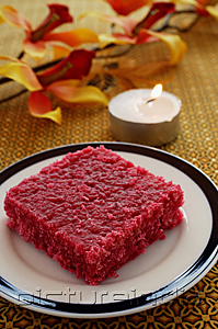PictureIndia - Red burfi with a candle