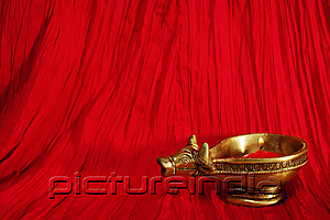 PictureIndia - A golden ox candle holder and candle