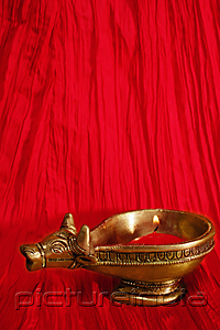 PictureIndia - A golden ox candle holder and candle