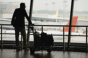 PictureIndia - Man watching planes at airport