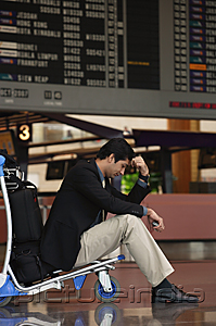 PictureIndia - Man waiting in departure lounge at airport