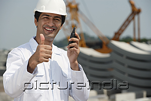 PictureIndia - Man in work uniform gives thumb up