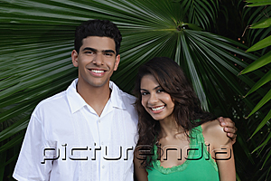 PictureIndia - Couple with arms around each other, smiling at camera