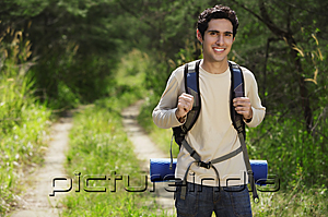 PictureIndia - Young man hiking in the wilderness