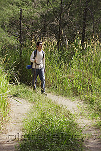PictureIndia - Young man hiking in the wilderness