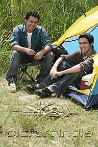 PictureIndia - Two friends camping smiling at camera