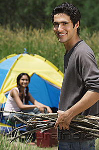 PictureIndia - Young couple camping in high grass